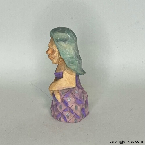 Left view of painted wood carved mermaid