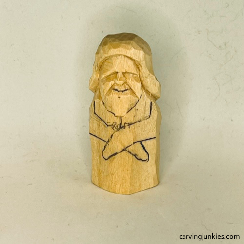 Mouth line is added to wood carved mermaid