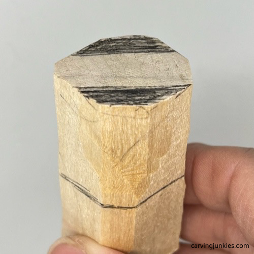 Wood marked for removal to roughout tail on wood carved mermaid