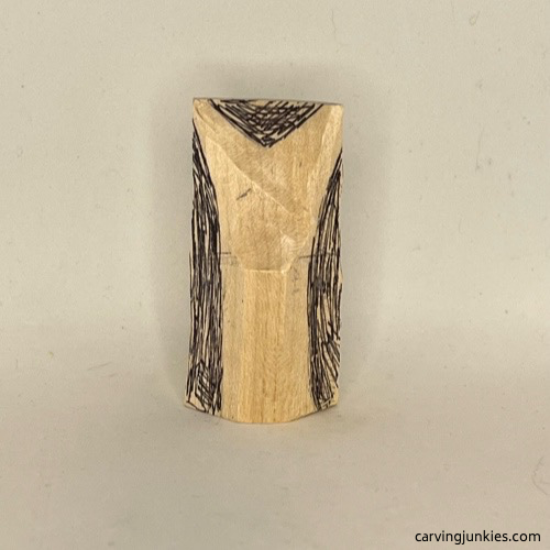 Tail is marked for further shaping on wood carved mermail