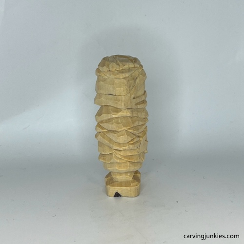 Heel is added on left side of wood carved mummy Heel drawn on right side of wood carved mummy