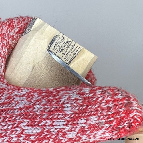 Separating feet on wood carved owl