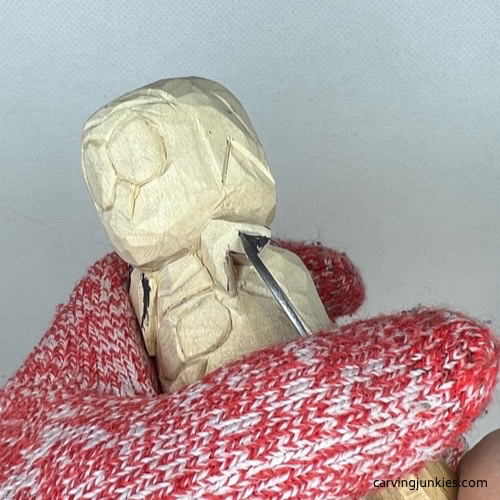 Carving talons on wood carved owl