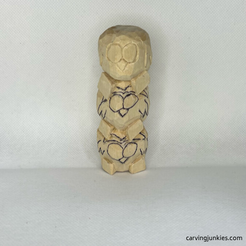 Carved details on wood carved owl