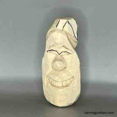 Eyes on wood carved pear are sketched