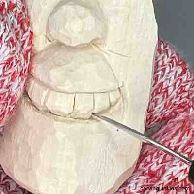 Carving teeth on wood carved pear