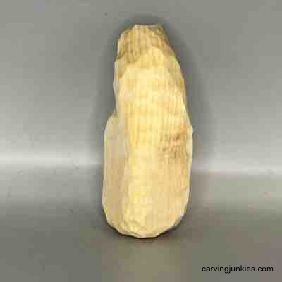 Back view of unpainted wood carved pear