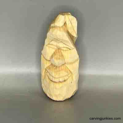 Front view of unpainted wood carving pear