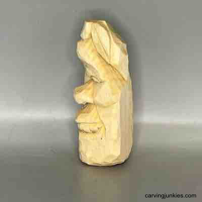 Left view of unpainted wood carved pear