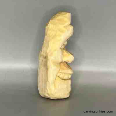 Right view of unpainted wood carved pear