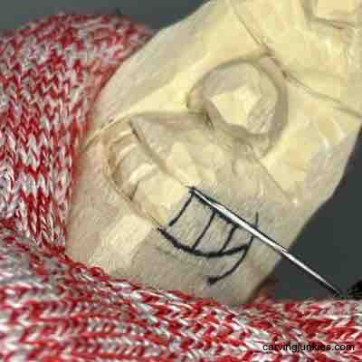 Carving teeth on wood carved pear