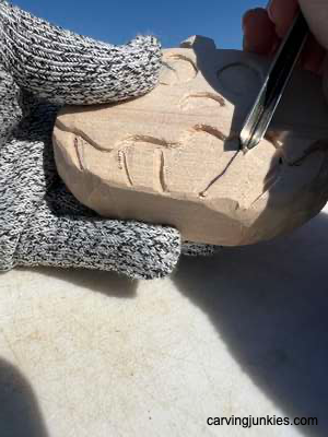 Using gouge on wooden pumpkin