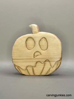 Front view of unpainted wood ghost pumpkin