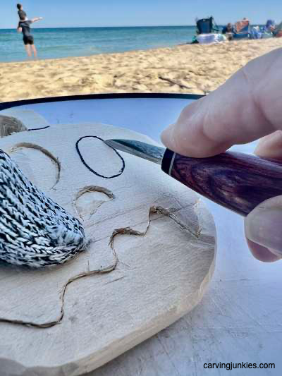 Separating the eyes on wooden ghost pumpkin