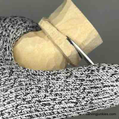 Carving hat on wood carved scaregrow