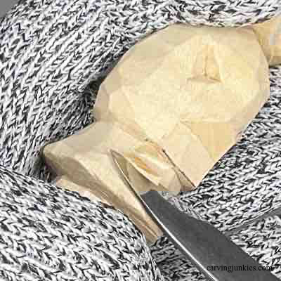 Shaping skirt of wood carved scarecrow