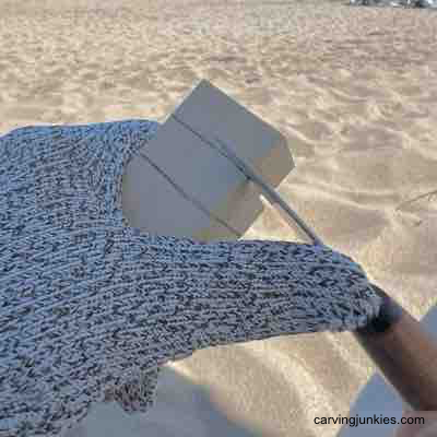 Making a stop cut to carve a scarecrow