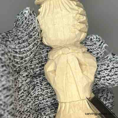 Carving straw on wood carved scarecrow