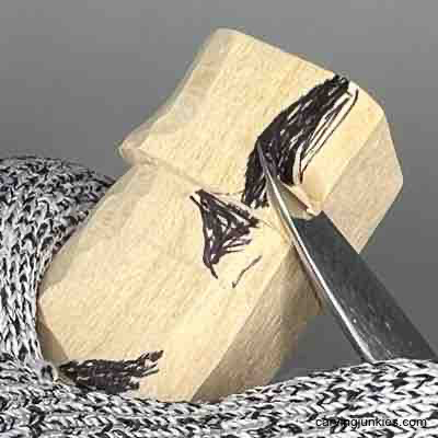 Using V-cut on wood carved scarecrow