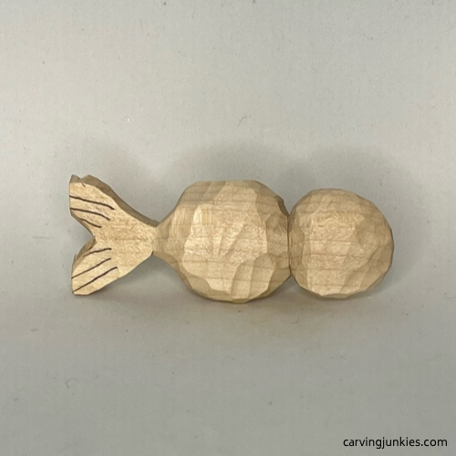 Lines sketched on back of wood carved seal