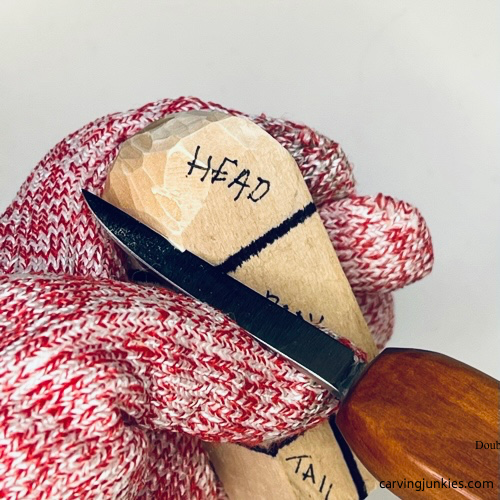Shaping bottom of head on wood carved seal
