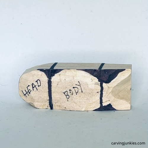 The body of the wood carved seal is sketched