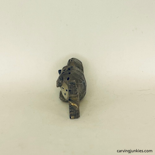 Left view of painted wood carved seal