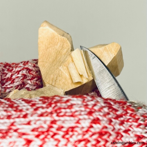 Curving the tail on wood carved seal