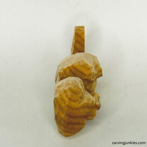 Right view of unpainted wood carved seal