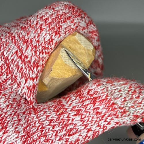 Shaping leaf on four-leaf clover wood carving
