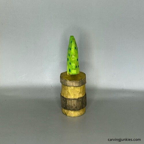 Left view of wood carved four-leaf clover after painting