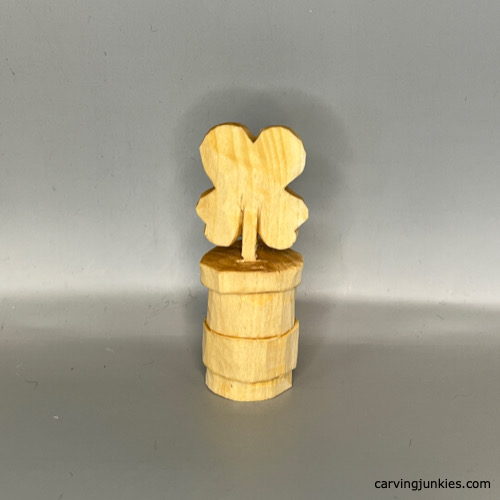 Front view of completed wood carved four-leaf clover prior to painting