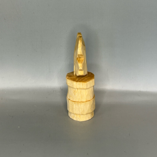 Left side of completed wooden four-leaf clover carving prior to painting