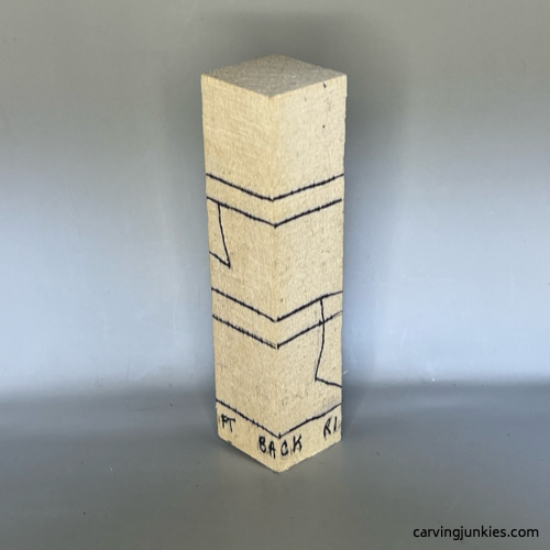 Back view of guidelines on wood carved snowman