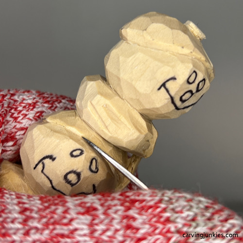 Carving hat on wood carved snowman