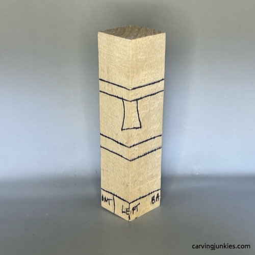 Left view of guidelines on wood carved snowman