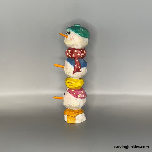 Left view of painted wood carved snowman