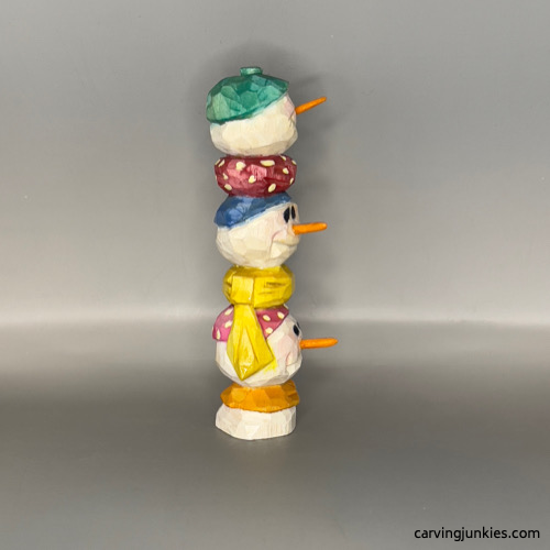 Right view of painted wood carved snowman