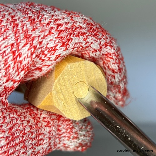 Using a U-gouge to reserve wood on wood carved snowman