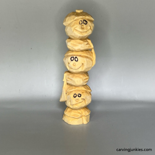 Front of unpainted wood carved snowman