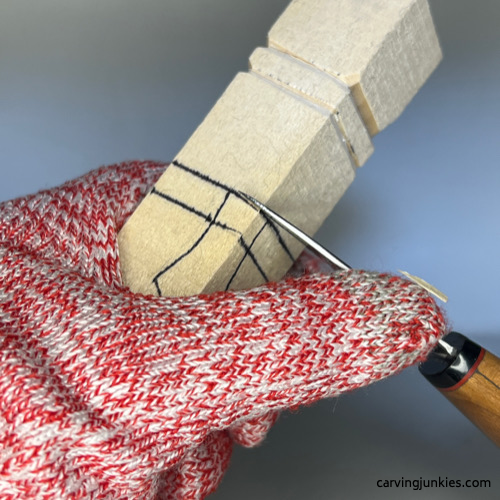 Making a stop cut to start wood carved snowman