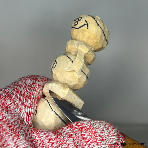 Shaping scarf on wood carved snowman