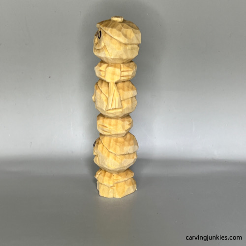 Unpainted wood carved snowman