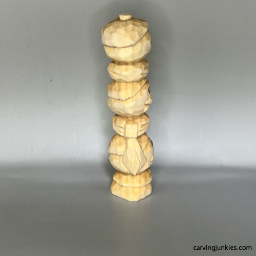 Right view of unpainted wood carved snowman