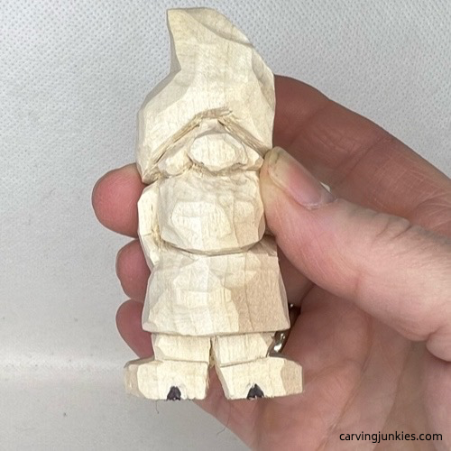 Heels are marked on wood carved Valentine gnome