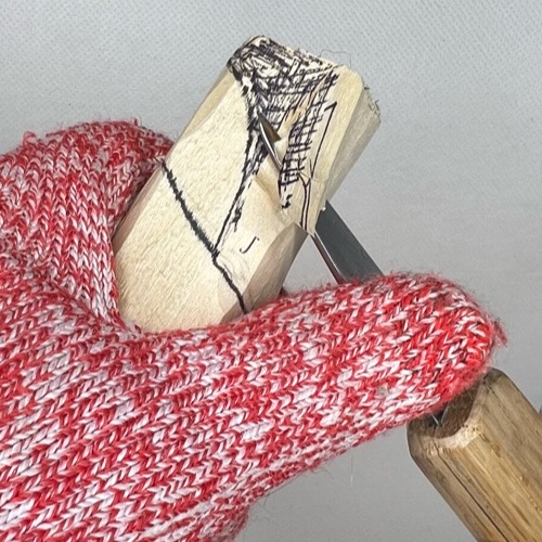 Shaping back of wood carved valentine gnome hat