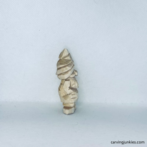 Right view of unpainted valentine wood carved gnome