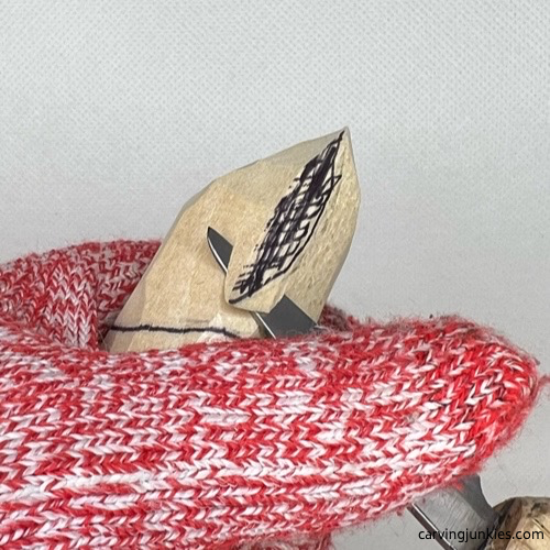 Making a V-cut on wood carved valentine gnome