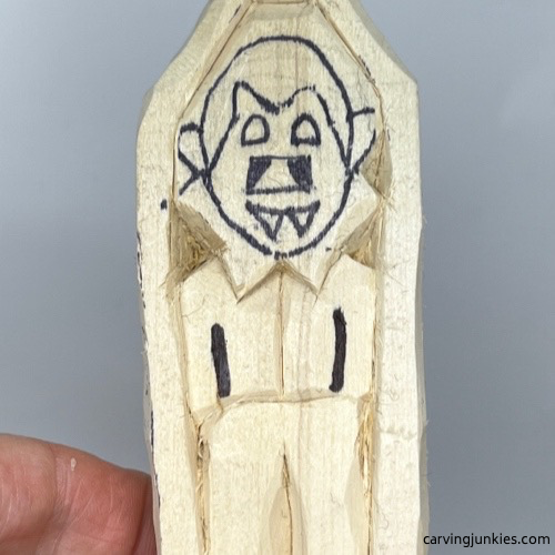 Arms drawn on wood carved vampire