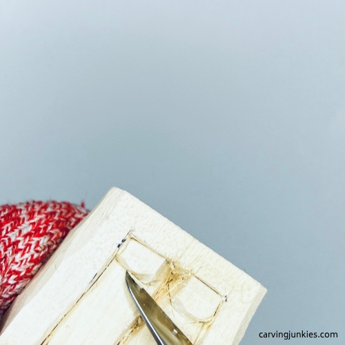 Carving feet on wood carved vampire